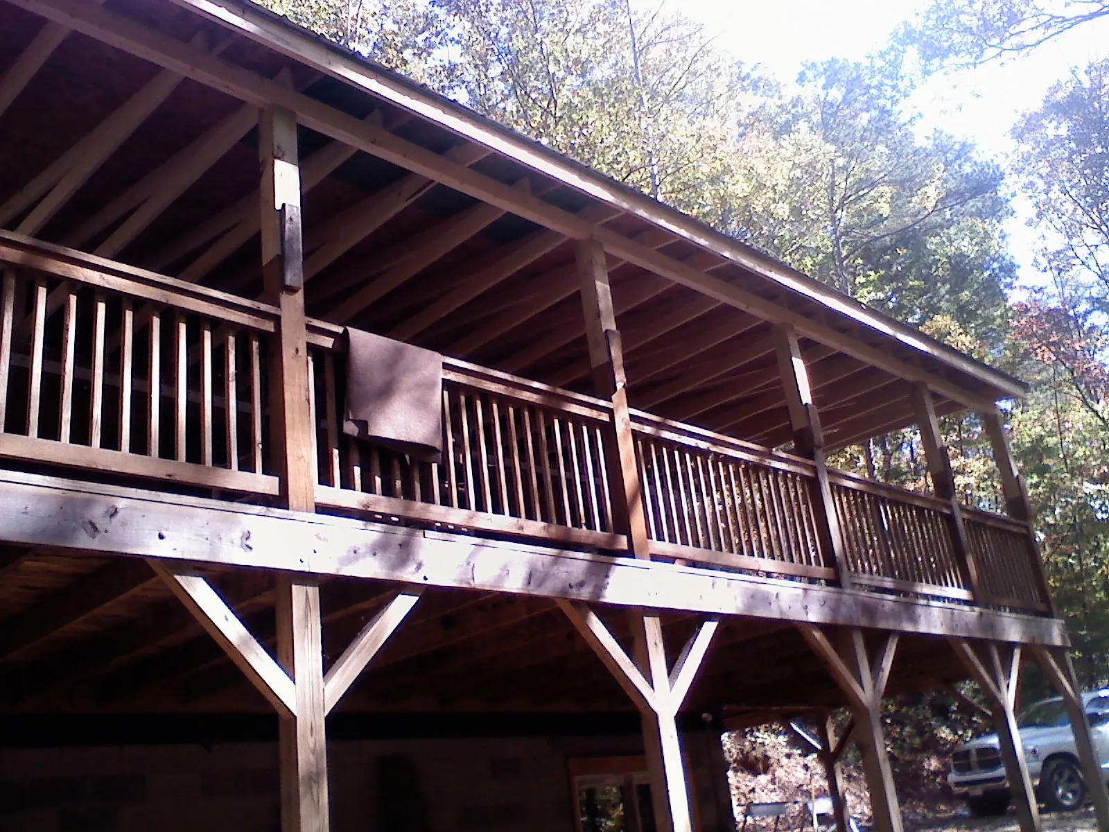 Timber framing under a new elevated porch and deck — Roof Leak Repair in Otis by Roofing Brothers